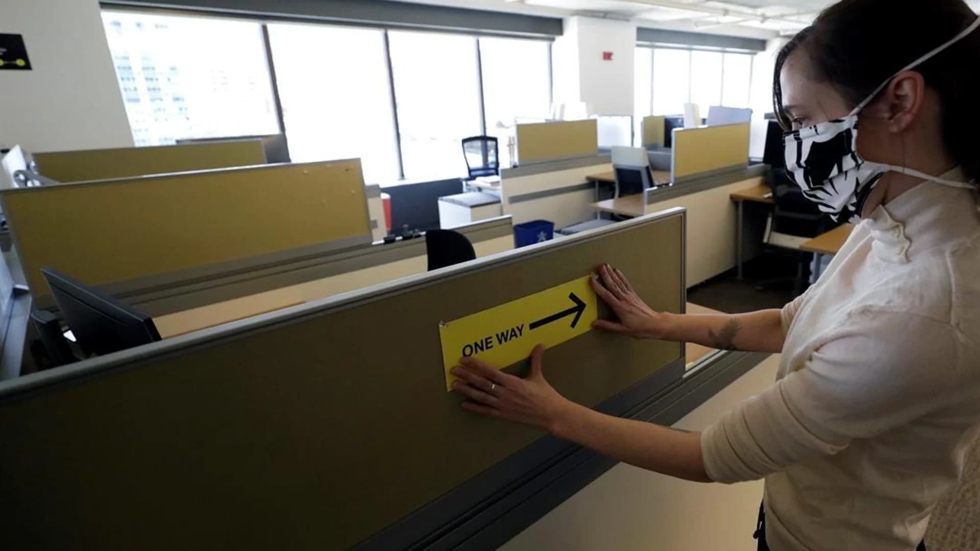Taller cubicles, one-way aisles: Returning office workers face adjustments amid pandemic