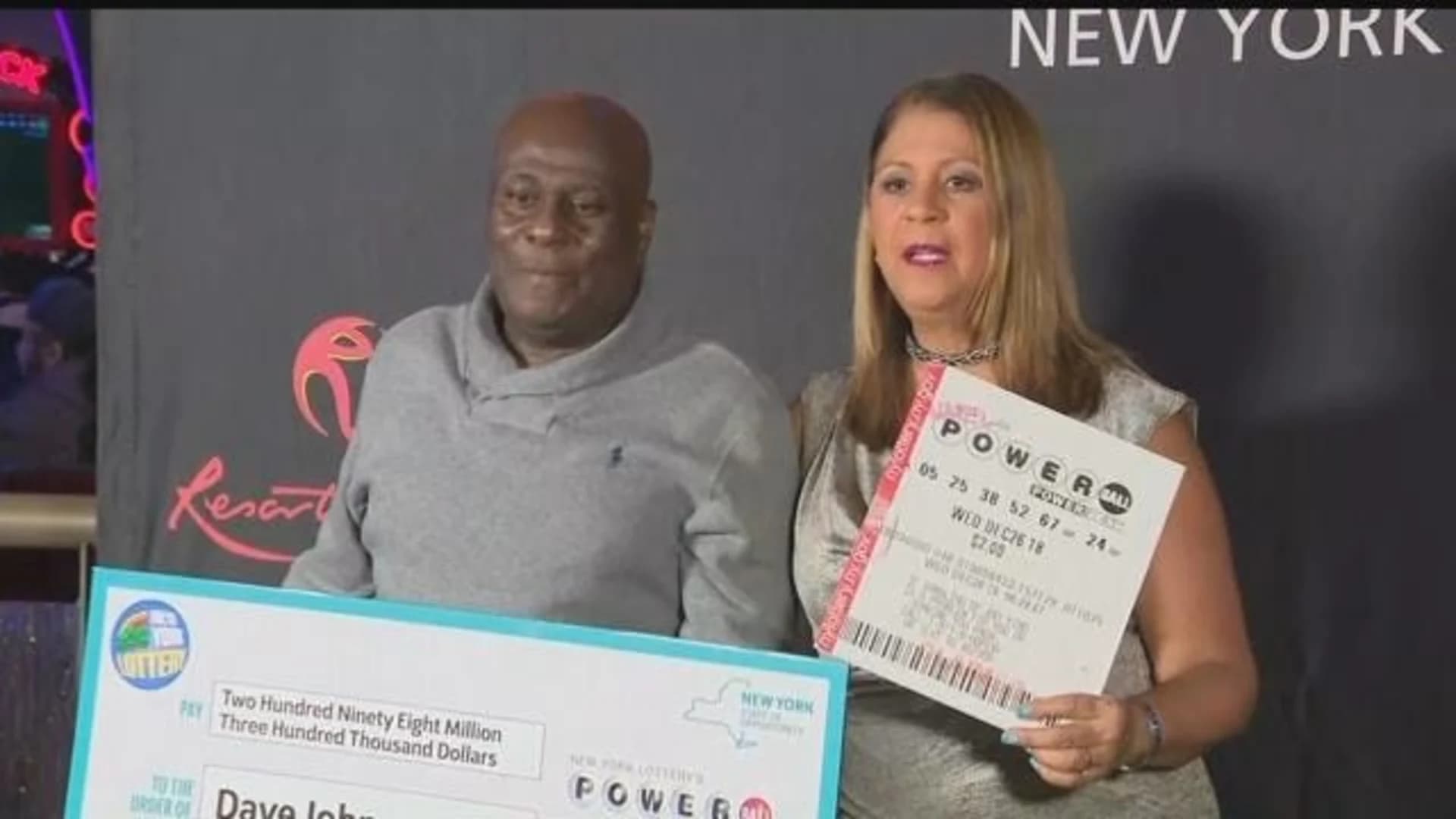 $298.3M check presented to New Yorker who won Powerball
